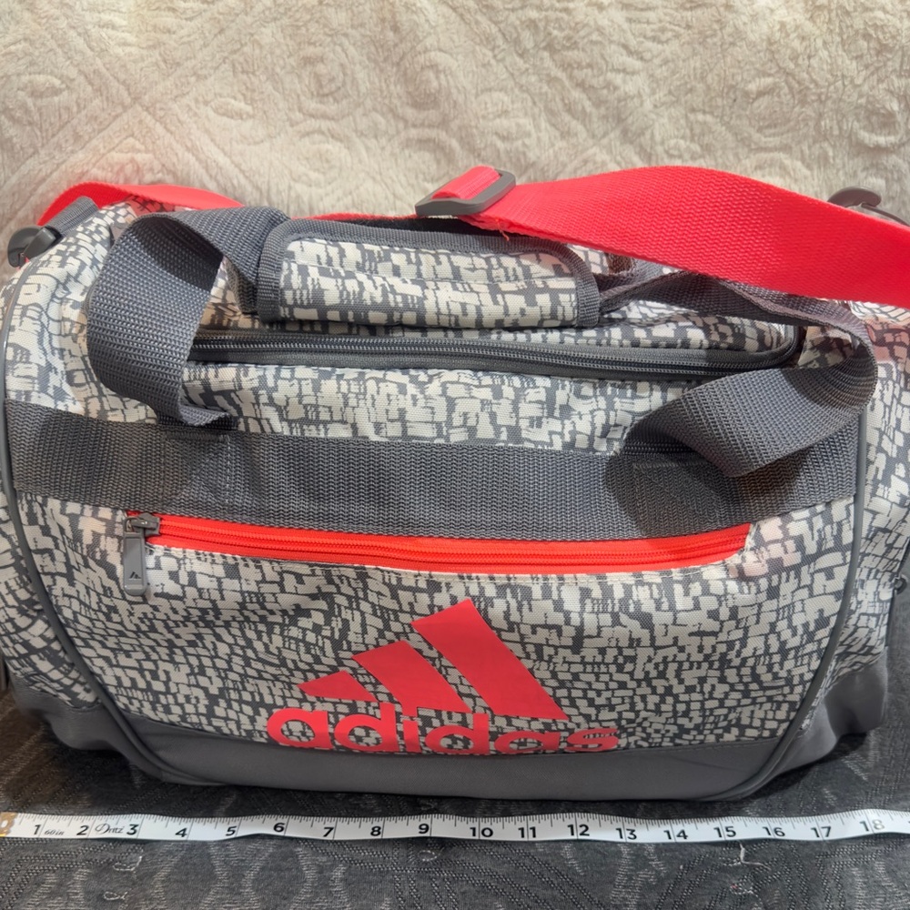 Adidas Gray and Red Duffel Bag for Versatile Use